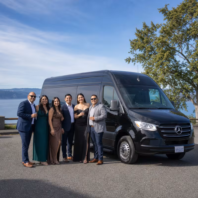 Group beside a Mercedes Sprinter limo from the Tacoma fleet