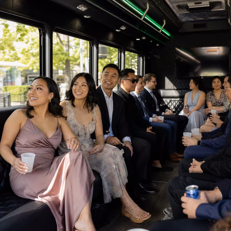 Wedding guests seated inside a Tacoma party bus
