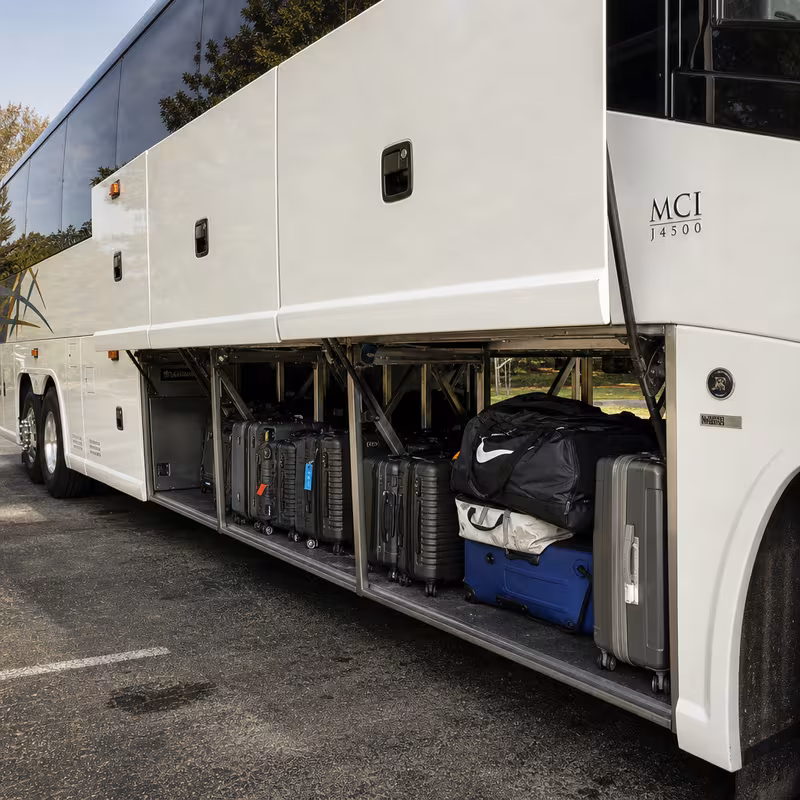 Party bus interior with wraparound leather seating and LED lighting in Tacoma
