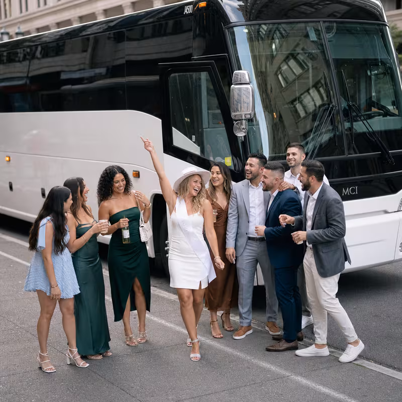 Passengers loading luggage while boarding an Tacoma group shuttle
