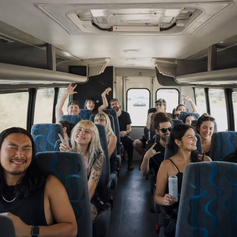 Party bus interior with wraparound leather seating and LED lighting in Tacoma