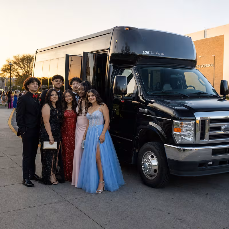 Group boarding a white charter bus for Prom & Homecoming Transportation transportation in Tacoma