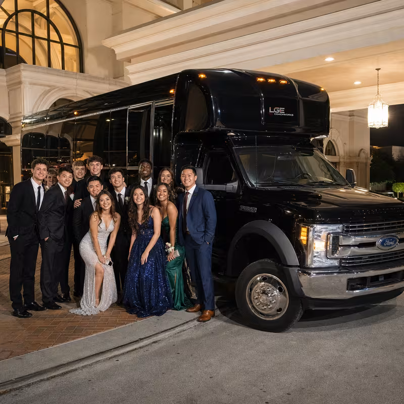 Party bus interior with wraparound leather seating and LED lighting in Tacoma