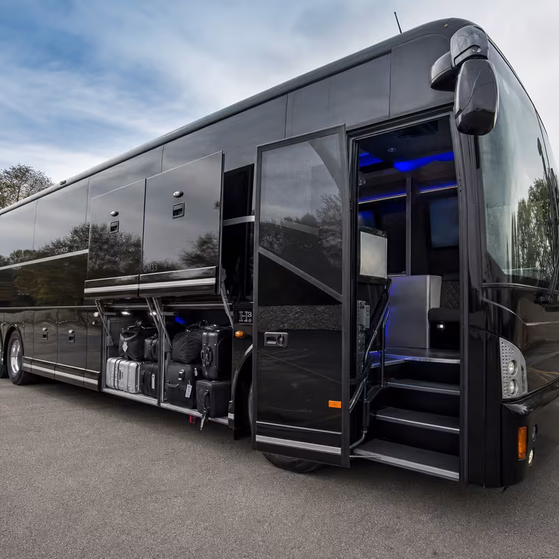 Party bus interior with wraparound leather seating and LED lighting in Tacoma