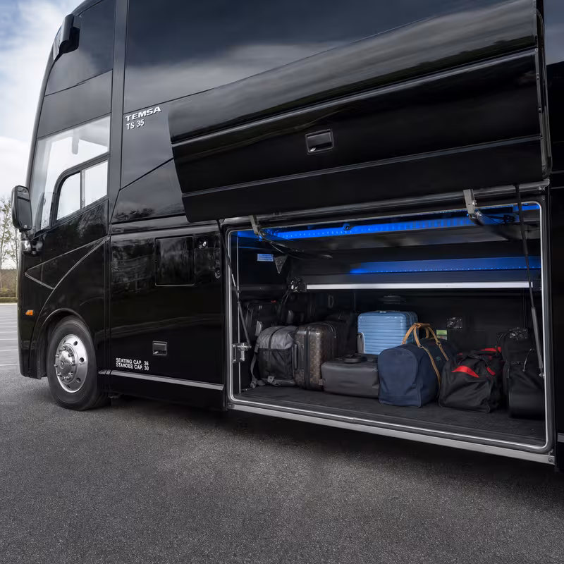 Party bus interior with wraparound leather seating and LED lighting in Tacoma